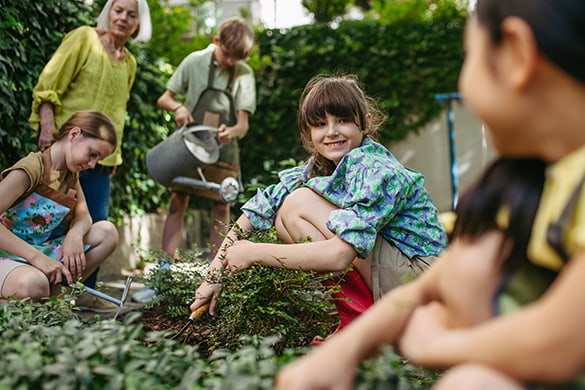Students dig in a garden on a school field trip