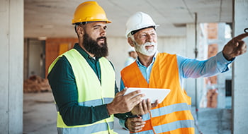 construction workers discussing project plans